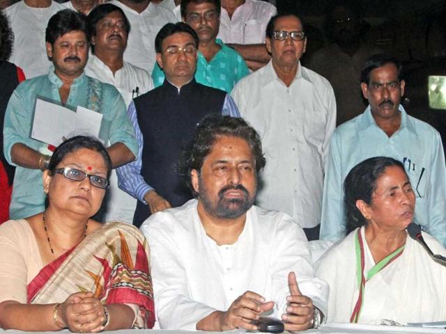 West Bengal chief minister Mamata Banerjee with party leaders interacts with media at the end of party emergency meeting in Kolkata. (PTI Photo by Swapan Mahapatra)
