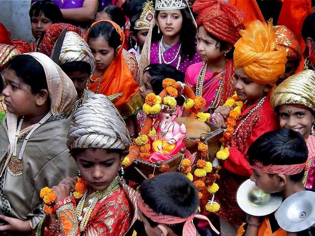 Children participate in a religious procession on the occasion of 'Ganesh Chathurti' festival in Sangli, Maharashtra. (PTI Photo)