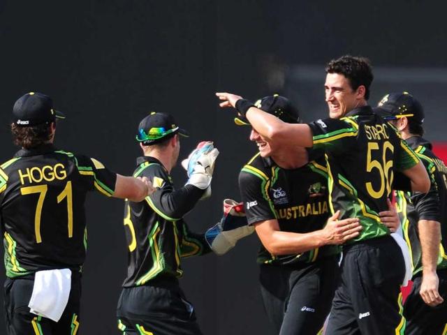 Glenn Maxwell (2nd R) celebrates with teammates after he dismissed Ireland cricketer Ed Joyce during the ICC Twenty20 Cricket World Cup match between Australia and Ireland at the R. Premadasa Stadium in Colombo. AFP Photo