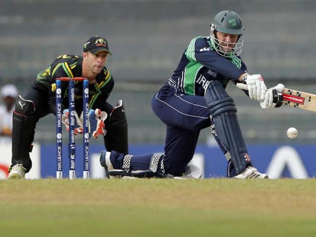 Niall O'Brien, right, plays a shot in front of Australian wicketkeeper Matthew Wade during their ICC Twenty20 Cricket World Cup match in Colombo. AP Photo