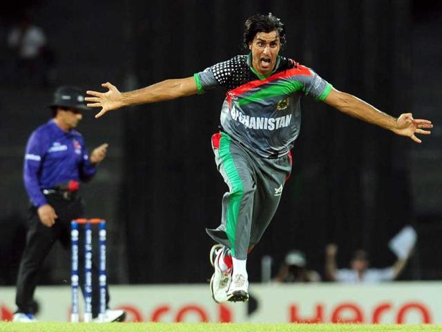 Afghanistan cricketer Shapoor Zadran (R) celebrates after he dismissed Gautam Gambhir during the ICC Twenty20 Cricket World Cup match between India and Afghanistan at the R Premadasa Stadium in Colombo. AFP/Lakruwan Wanniarachchi