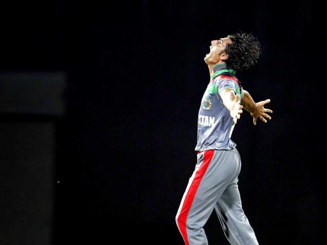 Afghanistan's Shapoor Zadran celebrates the dismissal of Virender Sehwag during the ICC T20 World Cup cricket match between India and Afghanistan at R Premadasa Stadium in Colombo, Sri Lanka. HT/Ajay Aggarwal