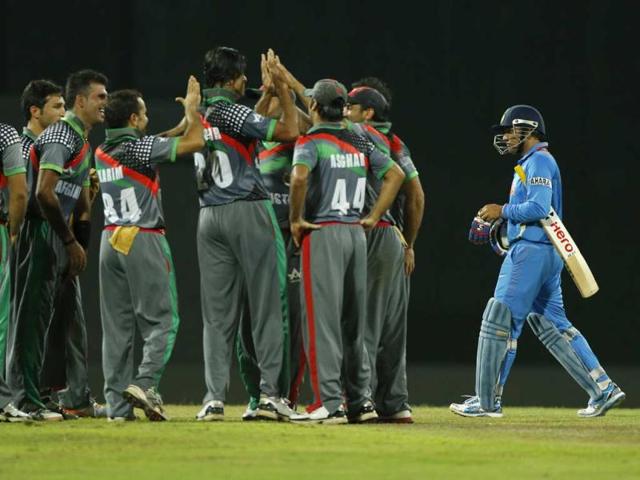 Afghanistan-teammates-celebrate-the-wicket-of-Virender-Sehwag-right-during-their-ICC-Twenty20-Cricket-World-Cup-match-in-Colombo-Sri-Lanka-AP-Eranga-Jayawardena