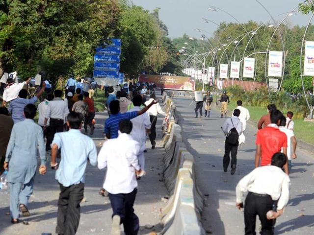 Pakistani demonstrators charge as they attempt to reach the US embassy during a protest against an anti-Islam film in Islamabad. AFP Photo/Aamir Qureshi