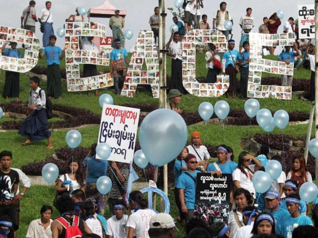 Participants gather to mark the International Day of Peace in Yangon, Myanmar. They pray for a cease-fire in the long-running ethnic insurgency in their Kachin State. AP Photo/Khin Maung Win