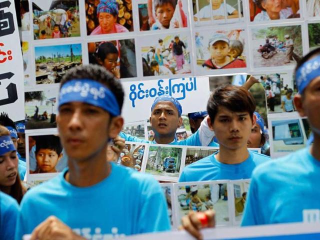 People hold posters during a march against civil war to mark the International Day of Peace in Yangon. Hundreds of people including farmers and ethnic groups participated in the march. Reuters photo