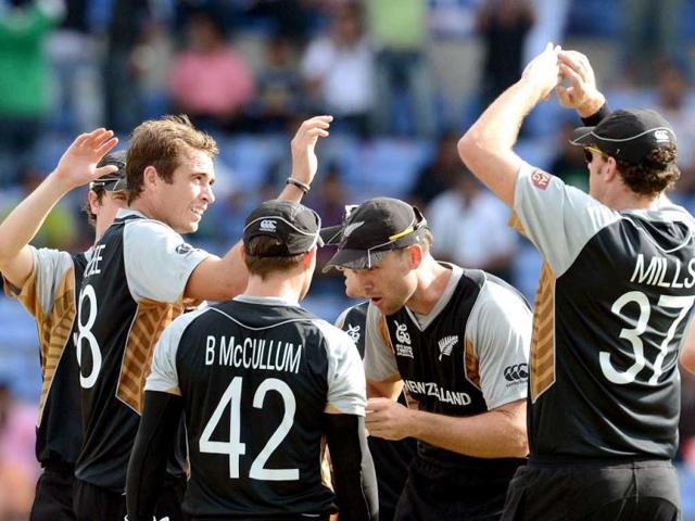 New Zealand bowler Tim Southee (2L) celebrates the wicket of Pakistan cricketer Imran Nazir with teammates during the ICC Twenty20 Cricket World Cup match between Pakistan and New Zealand at the Pallekele International Cricket Stadium in Pallekele. AFP Photo/ Prakash Singh