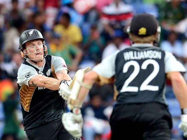 New Zealand cricketer Kane Williamson watches as Rob Nicol plays a shot during the ICC Twenty20 Cricket World Cup match between Pakistan and New Zealand at the Pallekele International Cricket Stadium in Pallekele. AFP Photo/ Prakash Singh