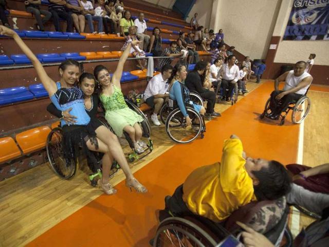 Alondra Lopez, Miguel Osorio and Jazmin Lopez pose for a photo at the end of the First Regional Dance Competition on Wheelchair Sports in Cancun. Reuters/Victor Ruiz Garcia 