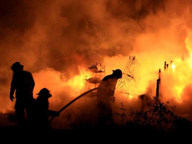 Unionville firefighters battle a blaze at a home on Kingdom Road near Rover, Tenn. Four people died in the fire, authorities said. AP/Shelbyville Times-Gazette, David Melson