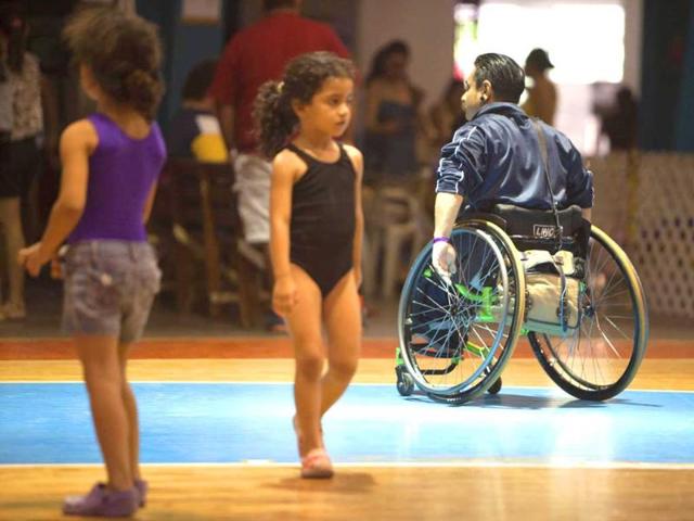 Miguel Osorio (R) trains at a basketball court before the First Regional Dance Competition on Wheelchair Sports in Cancun. Reuters/Victor Ruiz Garcia 