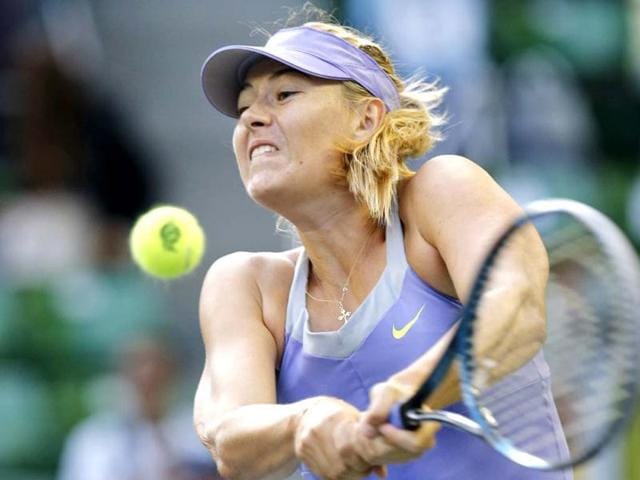 Maria Sharapova of Russia returns a shot against Lucie Safarova of the Czech Republic during their third round women's singles match at the Pan Pacific Open tennis tournament in Tokyo. Reuters