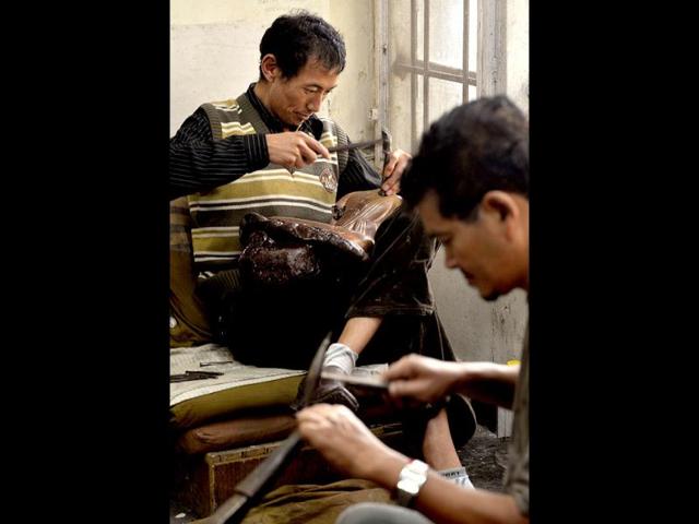 Traditional Tibetan craftsman hand sculpt metal figurines of the Buddha at the Norbulingka Institute near Dharamshala. The Norbulingka Institute is a centre for arts dedicated to the preservation of Tibetan art and culture. (AFP Photo)