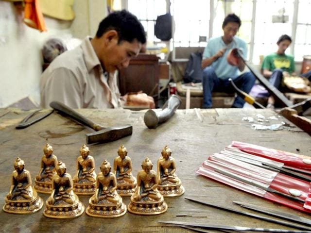 Traditional Tibetan craftsman hand sculpt metal figurines of the Buddha at the Norbulingka Institute near Dharamshala. The Norbulingka Institute is a centre for arts dedicated to the preservation of Tibetan art and culture. (AFP Photo)