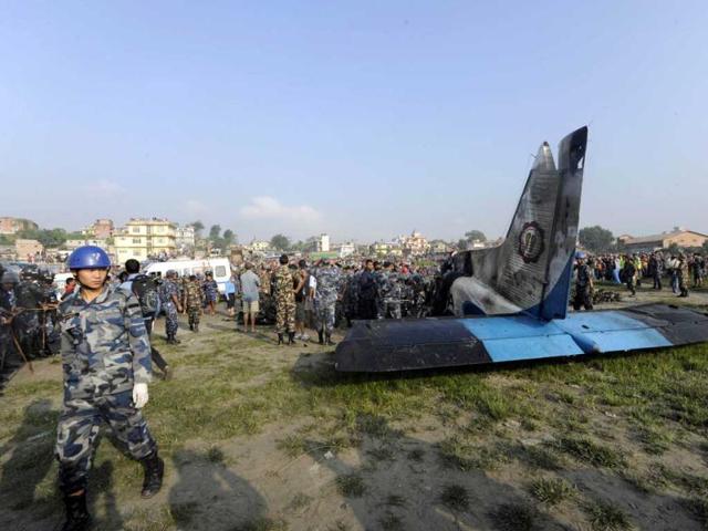 Rescuers are seen near the wreckage of an Sita Air Dornier plane crash site in Manohara, on the outskirts of Kathmandu. AFP/Prakash Mathema
