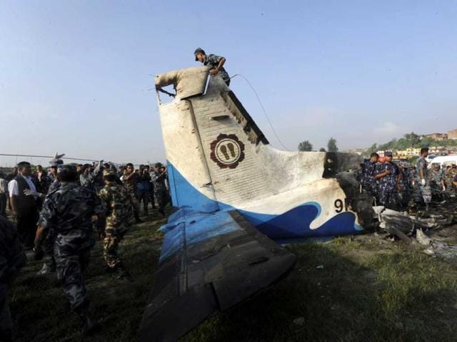 Rescuers are seen near the wreckage of an Sita Air Dornier plane crash site in Manohara, on the outskirts of Kathmandu. AFP/Prakash Mathema