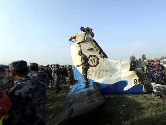 Rescuers are seen near the wreckage of an Sita Air Dornier plane crash site in Manohara, on the outskirts of Kathmandu. AFP/Prakash Mathema