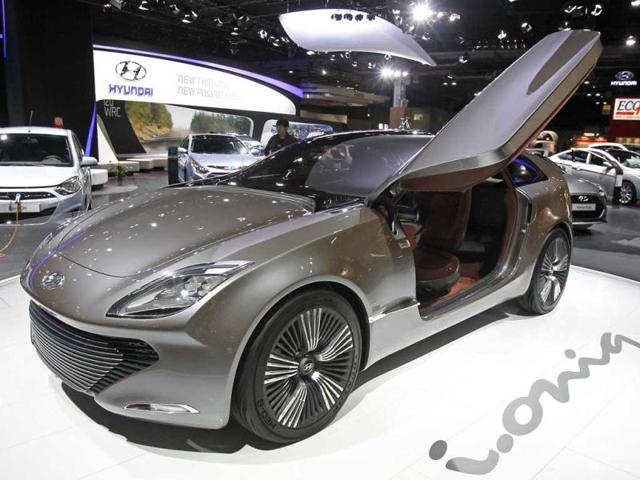 Partial view of the Hyundai stand on the eve of the opening of the Paris Auto Show, with the i-oniq hybrid at foreground. AP Photo/Remy de la Mauviniere