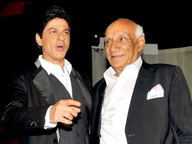 Yash Raj Chopra celebrates his birthday with Shah Rukh Khan at a film promotion in Mumbai on September 27, 2012.