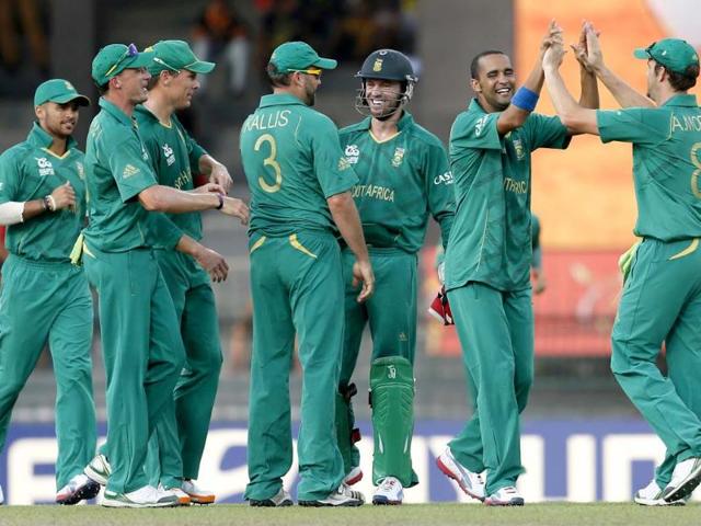 South African bowler Robin Pietersen celebrates the dismissal of Pakistan's batsman Nasir Jamshed with teammates Jean-Paul Duminy, Dale Steyn, Johan Botha, Jacques Kallis, captain AB de Villiers and Albie Morkel during their ICC Twenty20 Cricket World Cup Super Eight match in Colombo. (AP Photo/Gemunu Amarasinghe)