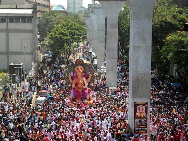Devotees gather around a huge idol of Lord Ganesha during the procession for immersion into the Arabian Sea, on the streets of Mumbai. AFP photo
