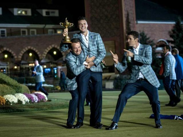 Team Europe's Graeme McDowell (L) of Northern Ireland, Martin Kaymer (C) of Germany and Justin Rose of England pose with the Ryder Cup after the final day of the 39th Ryder Cup at the Medinah Country Club in Medinah, Illinois. AFP Photo