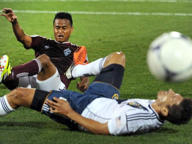 Colorado Rapids midfielder Jaime Castrillon gets tangled up with Los Angeles Galaxy midfielder Omar Gonzalez (R) during their MLS soccer match in Commerce City, Colorado. The game ended in a 1-1 tie. AP Photo