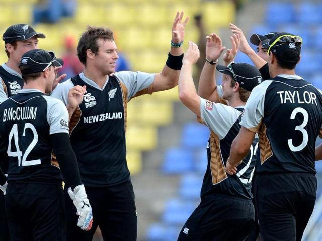 New Zealand cricketer Doug Bracewell (C) celebrates the wicket of West Indies cricketer Johnson Charles with teammates during the ICC Twenty20 Cricket World Cup's Super Eight match between New Zealand and West Indies at the Pallekele International Cricket Stadium in Pallekele. AFP Photo/Prakash Singh