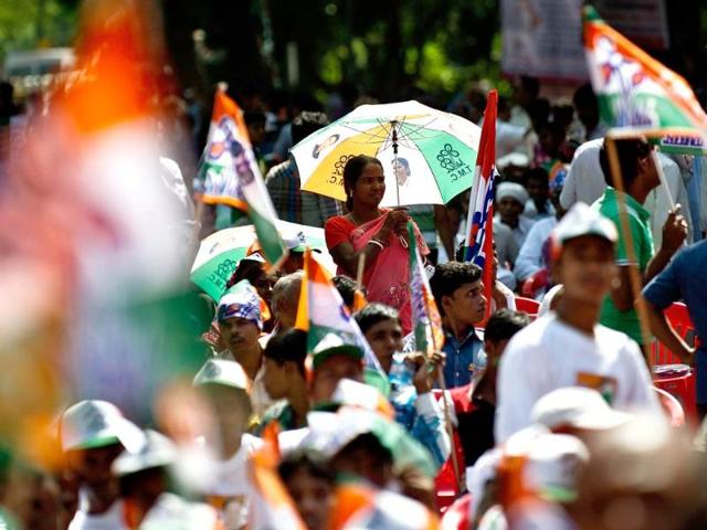 Trinamool Congress supporters listen to West Bengal chief minister Mamata Banerjee speaking against reforms on FDI in retail, cap on LPG subsidies and diesel price hikes during a protest in New Delhi. (AFP photo/ Manan Vatsyayana)