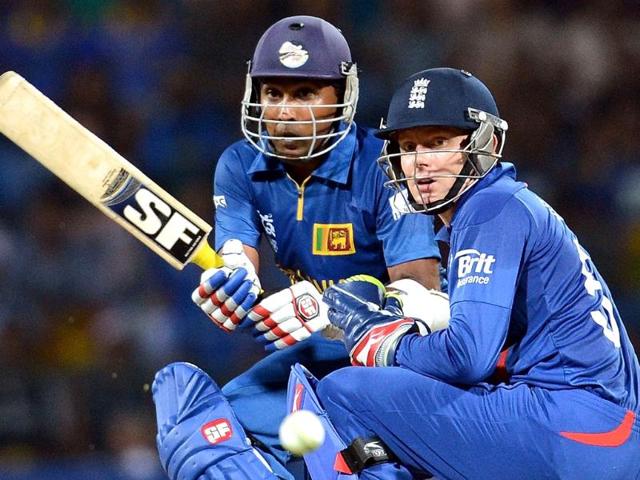 England wicket keeper Jonny Bairstow (R) watches as Sri Lanka cricketer Mahela Jayawardene plays a shot during the ICC Twenty20 Cricket World Cup Super Eight match between England and Sri Lanka at the Pallekele International Cricket Stadium in Pallekele. AFP Photo/ Prakash Singh