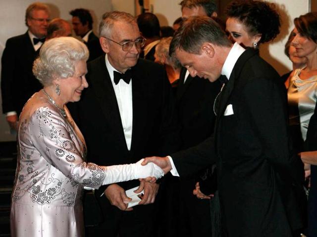 Britain's Queen Elizabeth II, left, meets actor Daniel Craig, the new James Bond, during the world premiere of the latest James Bond movie Casino Royale at the Odeon cinema in Leicester Square in London. (AP Photo/Stephen Hird, Pool, File)