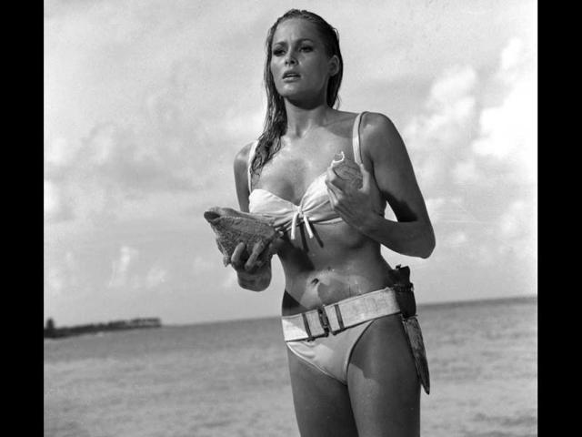 This undated publicity photo provided by United Artists and Danjaq, LLC shows Ursula Andress in a scene from the James Bond film, Dr. No. Her image personifies the gorgeous, mysterious cool of the Bond girl. The film is included in the MGM and 20th Century Fox Home Entertainment Blu-Ray Bond 50 anniversary set. (AP Photo/United Artists and Danjaq, LLC)