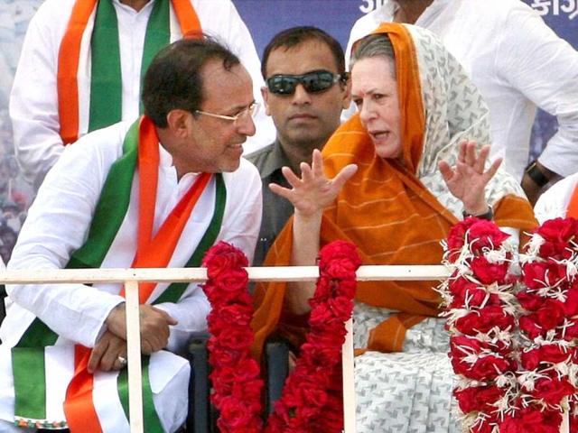 Congress president Sonia Gandhi with party's Gujarat chief Arjun Modhwadia at an election campaign rally in Rajkot. PTI photo