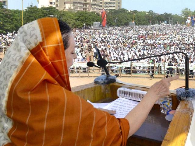 Congress president Sonia Gandhi addresses an election campaign rally in Rajkot. PTI photo