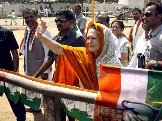Congress president Sonia Gandhi waves to supporters at a campaign rally ahead of the Gujarat state elections in Rajkot. AP Photo