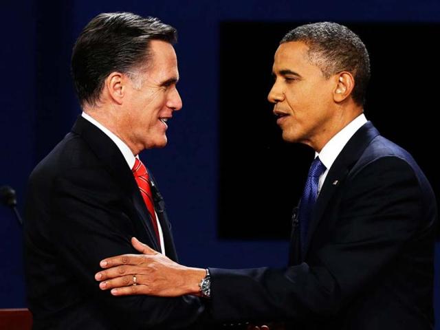 Republican presidential nominee Mitt Romney and President Barack Obama shake hands after the first presidential debate at the University of Denver in Denver. (AP Photo)