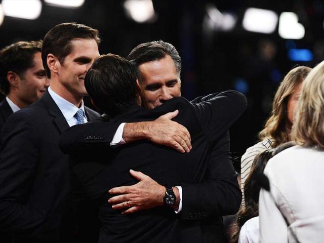 Republican presidential candidate Mitt Romney is surrounded by family following his debate with US President Barack Obama at the University of Denver in Denver, Colorado. (AFP Photo)