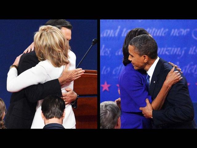 This combination of images show US President Barack Obama and Republican presidential candidate Mitt Romney embracing their spouses after the first presidential debate at the university of Denver in Denver, Colorado. (AFP Photo)