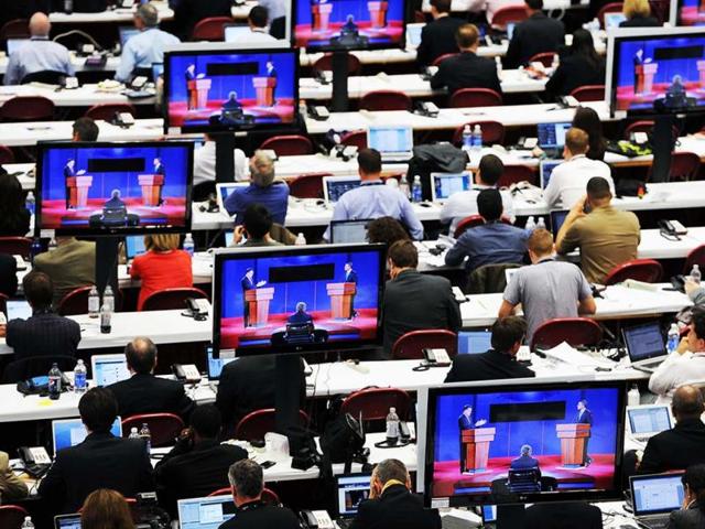 Journalists watch the first 2012 US Presidential Debate at the University of Denver in Denver. (AP Photo)