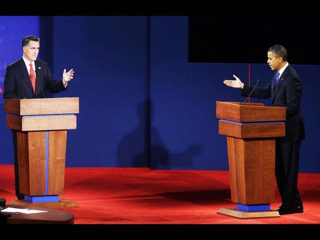 Republican presidential candidate, former Massachusetts Gov. Mitt Romney, left, and President Barack Obama, right, debate at the University of Denver in Denver. (AP Photo)