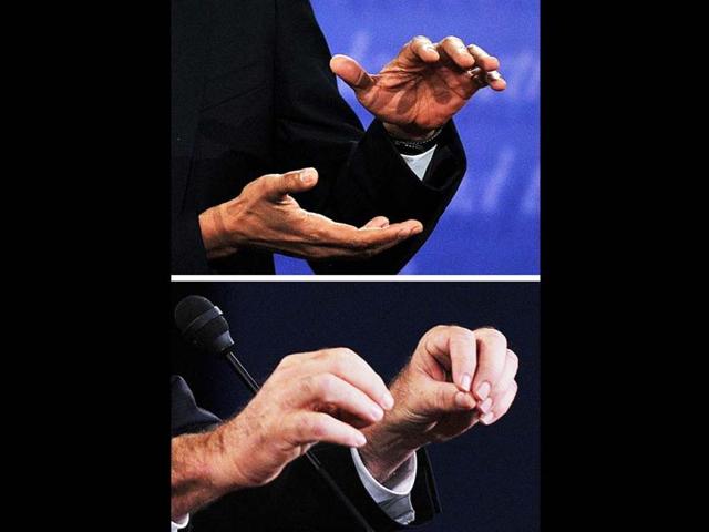 US President Barack Obama (top) speaks during his debate with Republican Presidential candidate Mitt Romney (bottom) at Magness Arena at the University of Denver in Denver, Colorado. (AFP Photo)