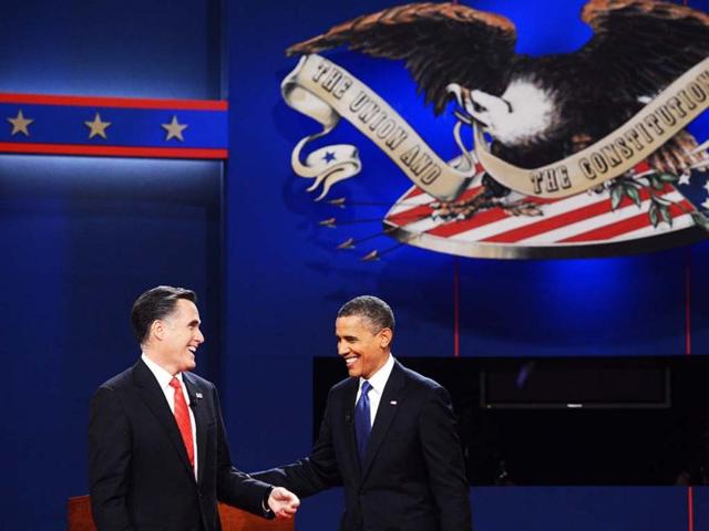 President Barack Obama (L) and Republican presidential nominee Mitt Romney share a laugh at the end of the first presidential debate in Denver. (Reuters)