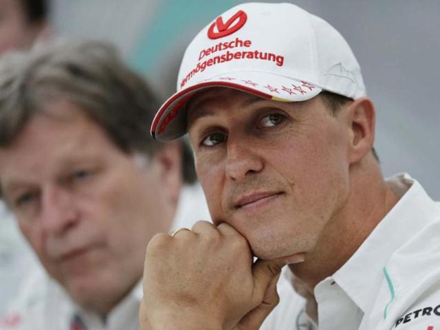 Mercedes driver Michael Schumacher, right, of Germany sits with teammate Norbert Haug, left, during a news conference to announce his retirement from Formula One at the end of the 2012 season at the Suzuka Circuit venue for the Japanese Formula One Grand Prix in Suzuka, Japan. AP Photo