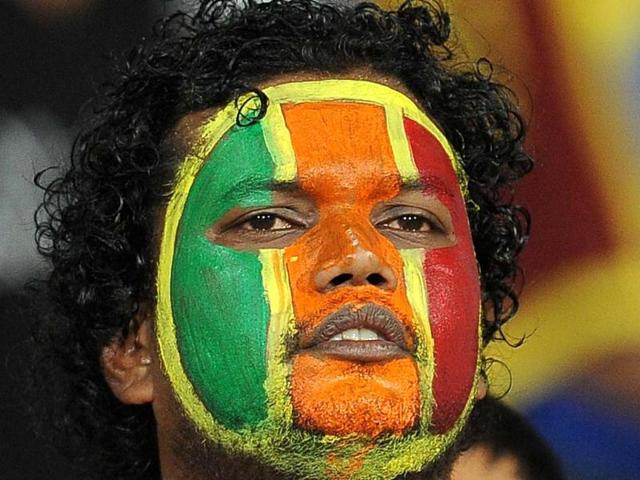 A Sri Lankan fan cheers during the ICC Twenty20 Cricket World Cup's semi-final match between Sri Lanka and Pakistan at the R Premadasa International Cricket Stadium in Colombo. AFP Photo/ Lakruwan Wanniarachchi
