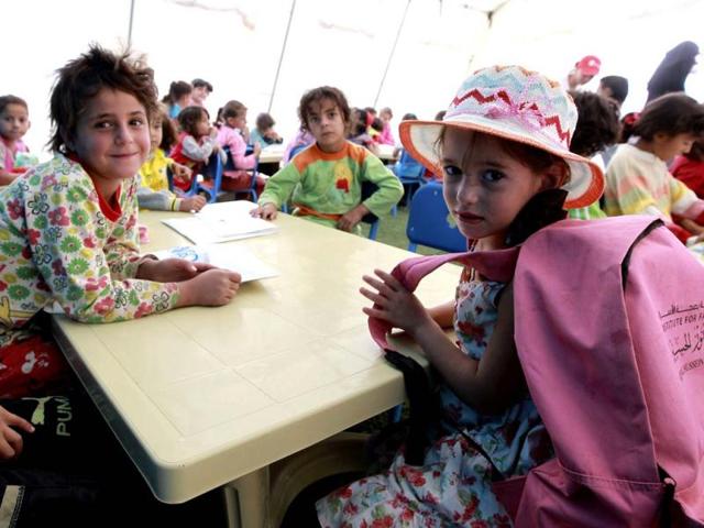 Syrian child refugees attend their fourth day of school at Al Zaatri refugee camp, in the Jordanian city of Mafraq, near the border with Syria. Reuters/Muhammad Hamed