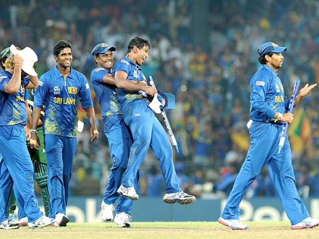 Members of the Sri Lanka cricket team celebrate after beating Pakistan during the ICC Twenty20 Cricket World Cup's semi-final match at the R. Premadasa International Cricket Stadium in Colombo . AFP Photo/Ishara S. Kodikara