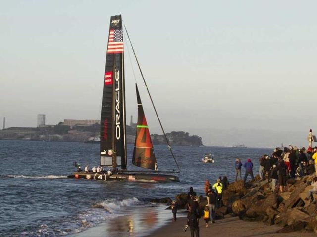 Oracle Team USA Spithill crosses the finish line to win the second of two fleet races with Alcatraz Island in the background at the America's Cup World Series sailing event in San Francisco. AP/Eric Risberg