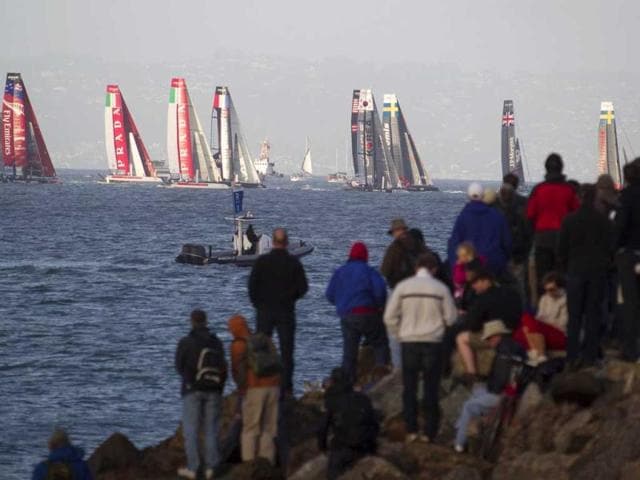Spectators on a jetty watch the second of two fleet races at the America's Cup World Series sailing event in San Francisco. AP/Eric Risberg