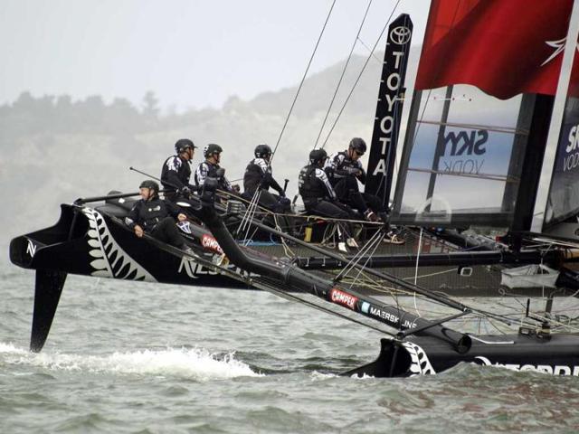 The crew aboard Emirates Team New Zealand races against the Energy Team of France during their quarterfinal match race of the America's Cup World Series sailing event in San Francisco. Emirates Team New Zealand won their race. AP/Eric Risberg