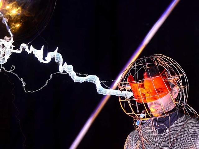 US Magician David Blaine stands under lighting bolts at the start of his latest performance, "Electrified", in New York. (AFP photo/Emmanuel Dunand)